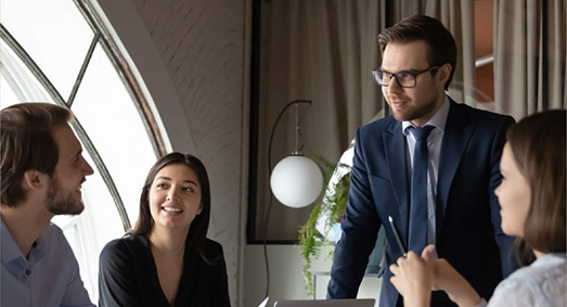 office discussion with four people